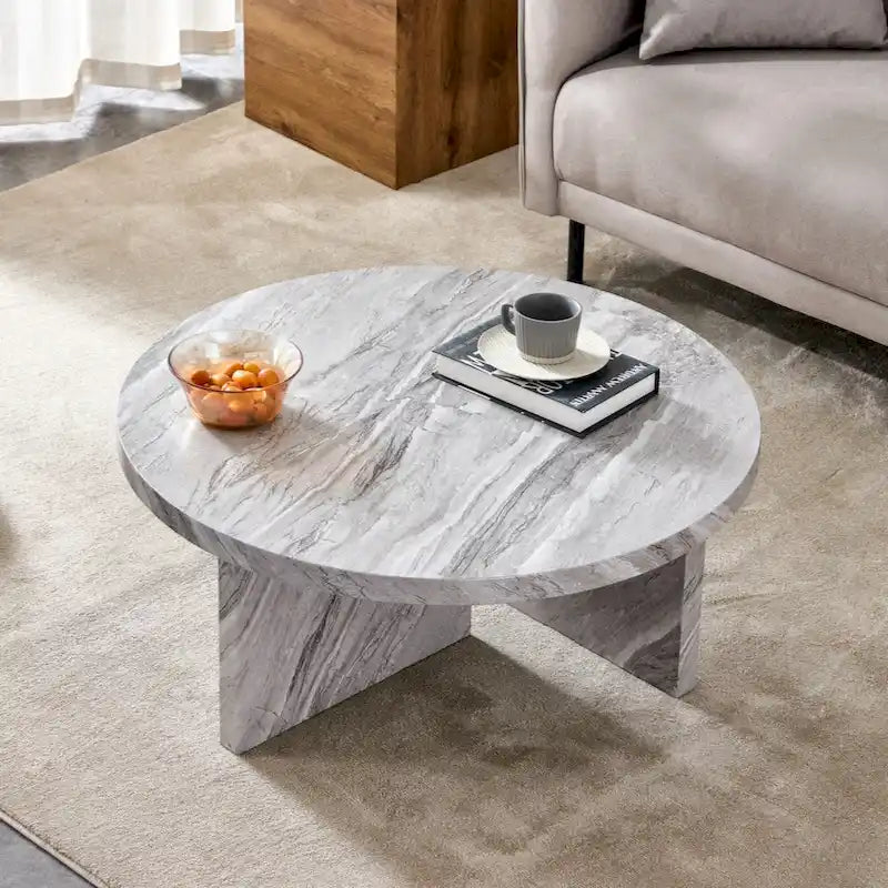 A white MDF material circular patterned coffee table suitable for small spaces and living rooms.