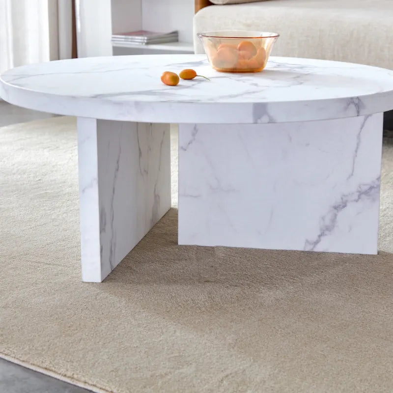 A white MDF material circular patterned coffee table suitable for small spaces and living rooms.