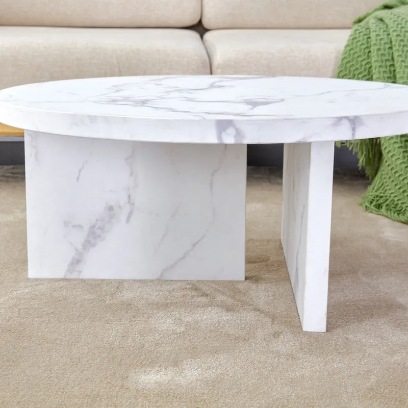 A white MDF material circular patterned coffee table suitable for small spaces and living rooms.